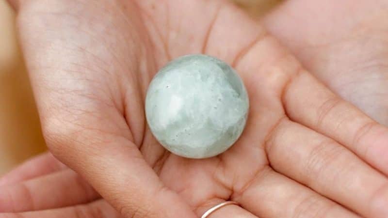 a hand holding a rock